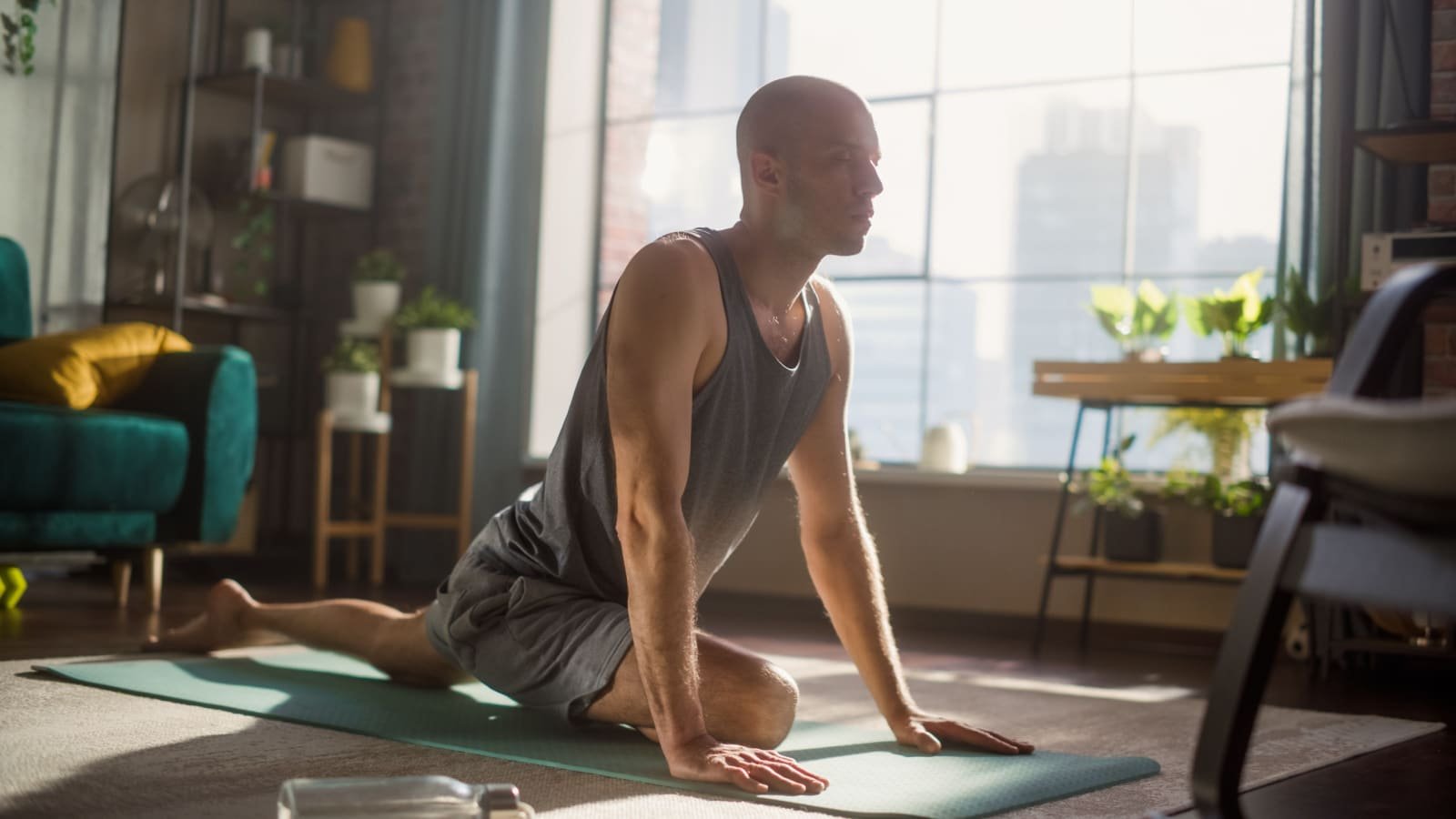 male doing yoga at home