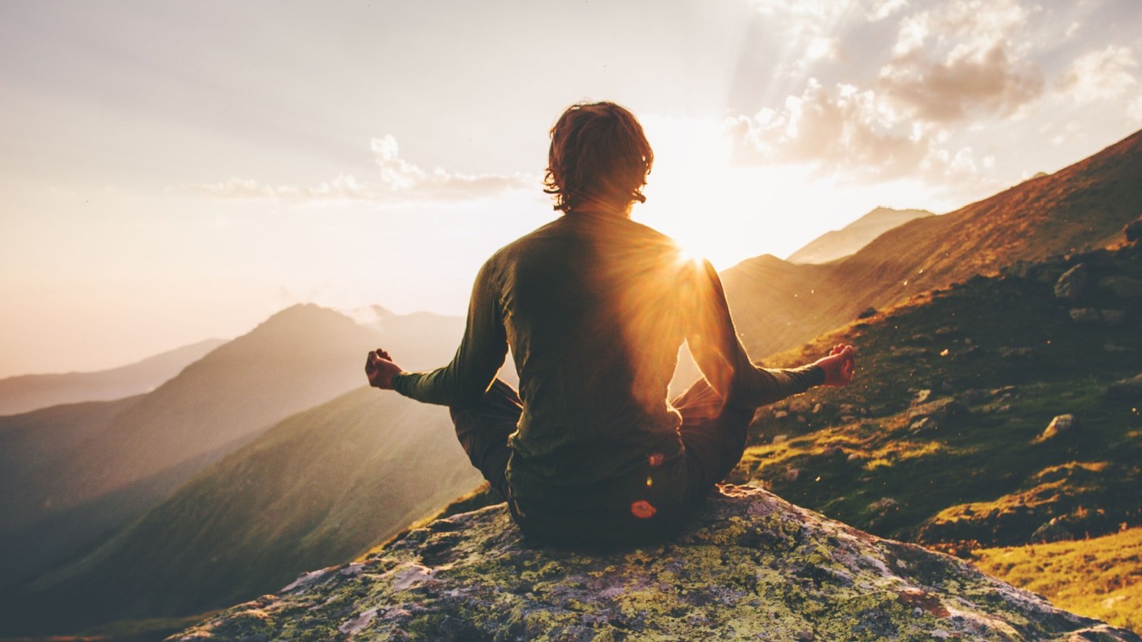 man doing yoga outdoors