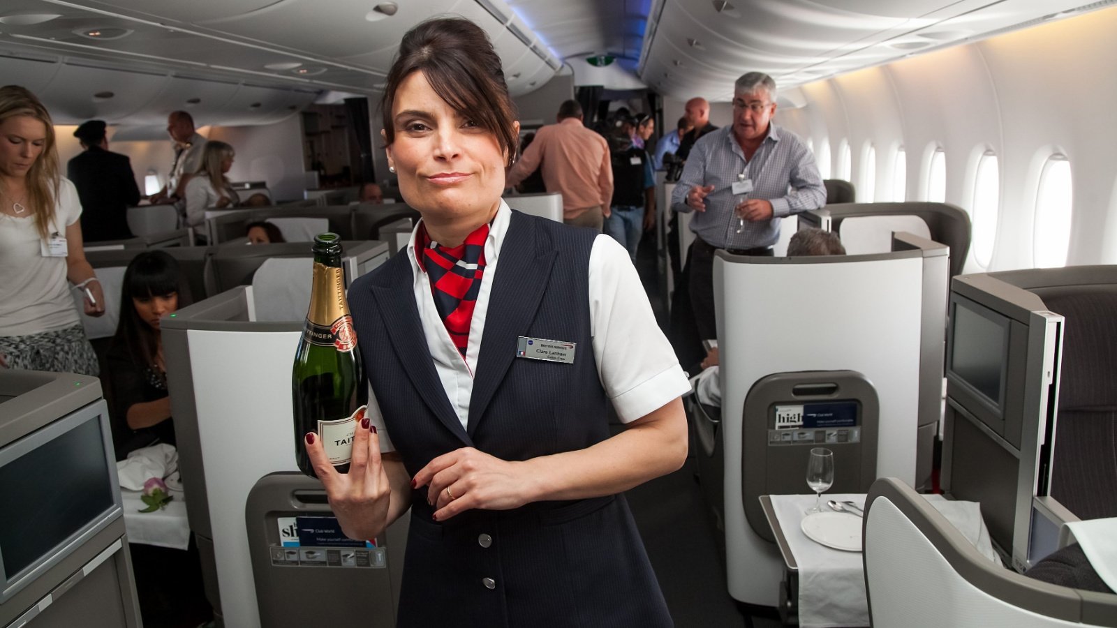 Airplane Travel Business Class woman Flight crew Attendant Luxury Travel Wirestock Creators Shutterstock