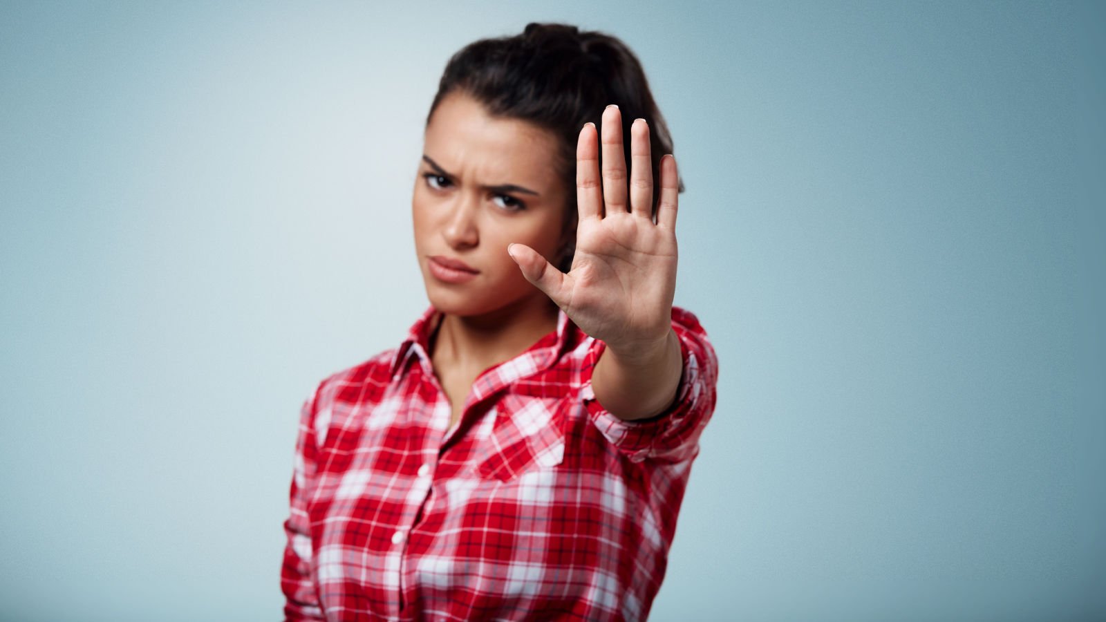 Angry woman gesturing hand stop no away Angry woman gesturing hand stop no away