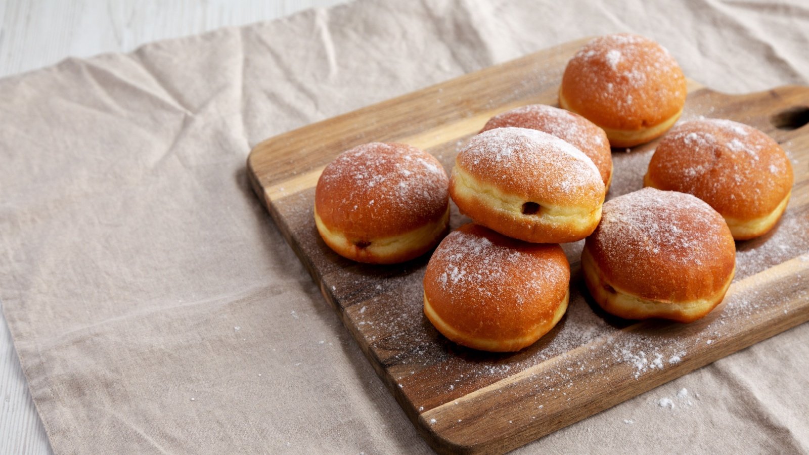 Apricot Polish Paczki apricot filled Donut with Powdered Sugar doughnut Fat Tuesday Liudmyla Chuhunova Shutterstock