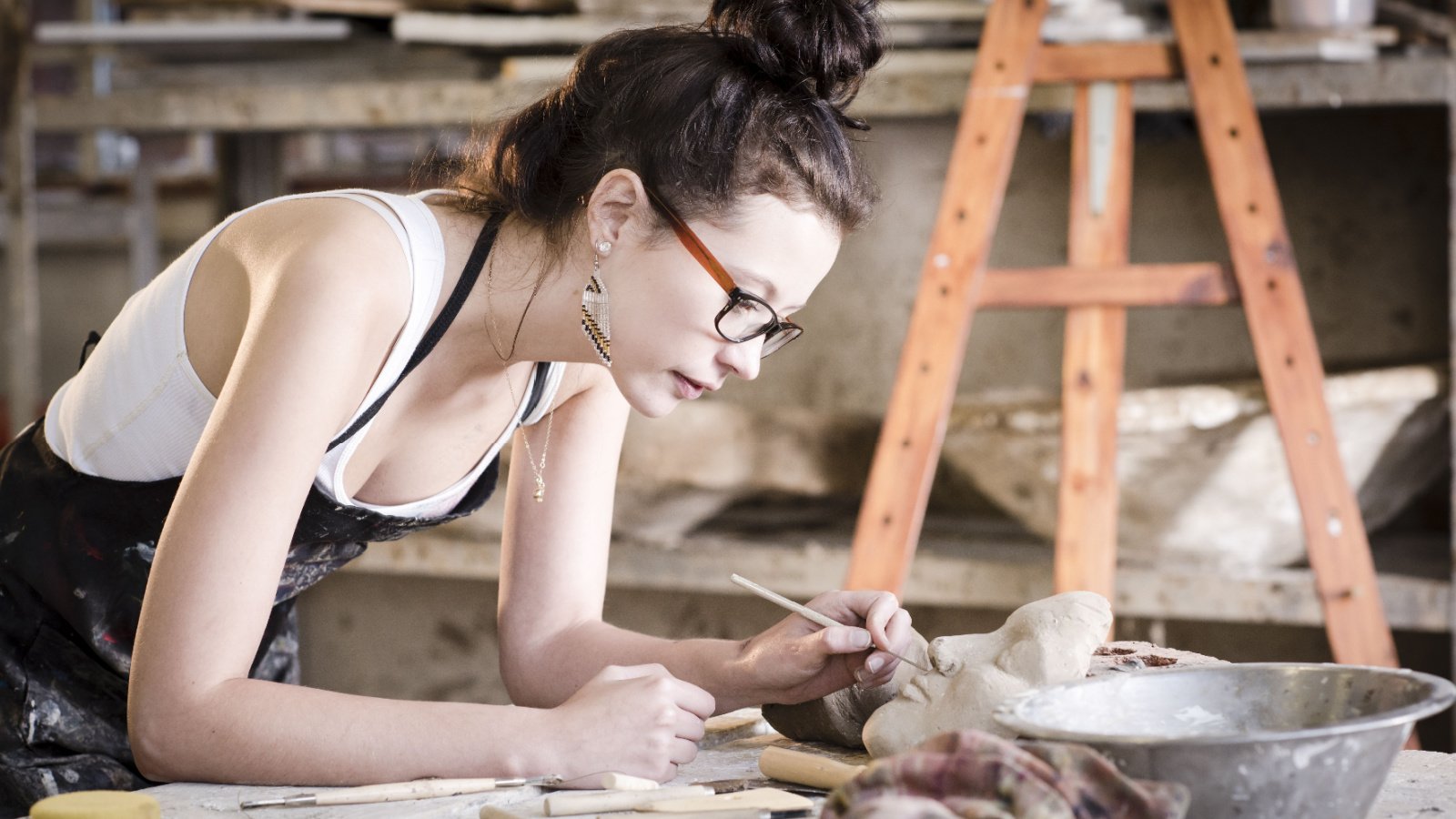 Artist Woman creating painting sculpting hobby Geoff Goldswain Shutterstock