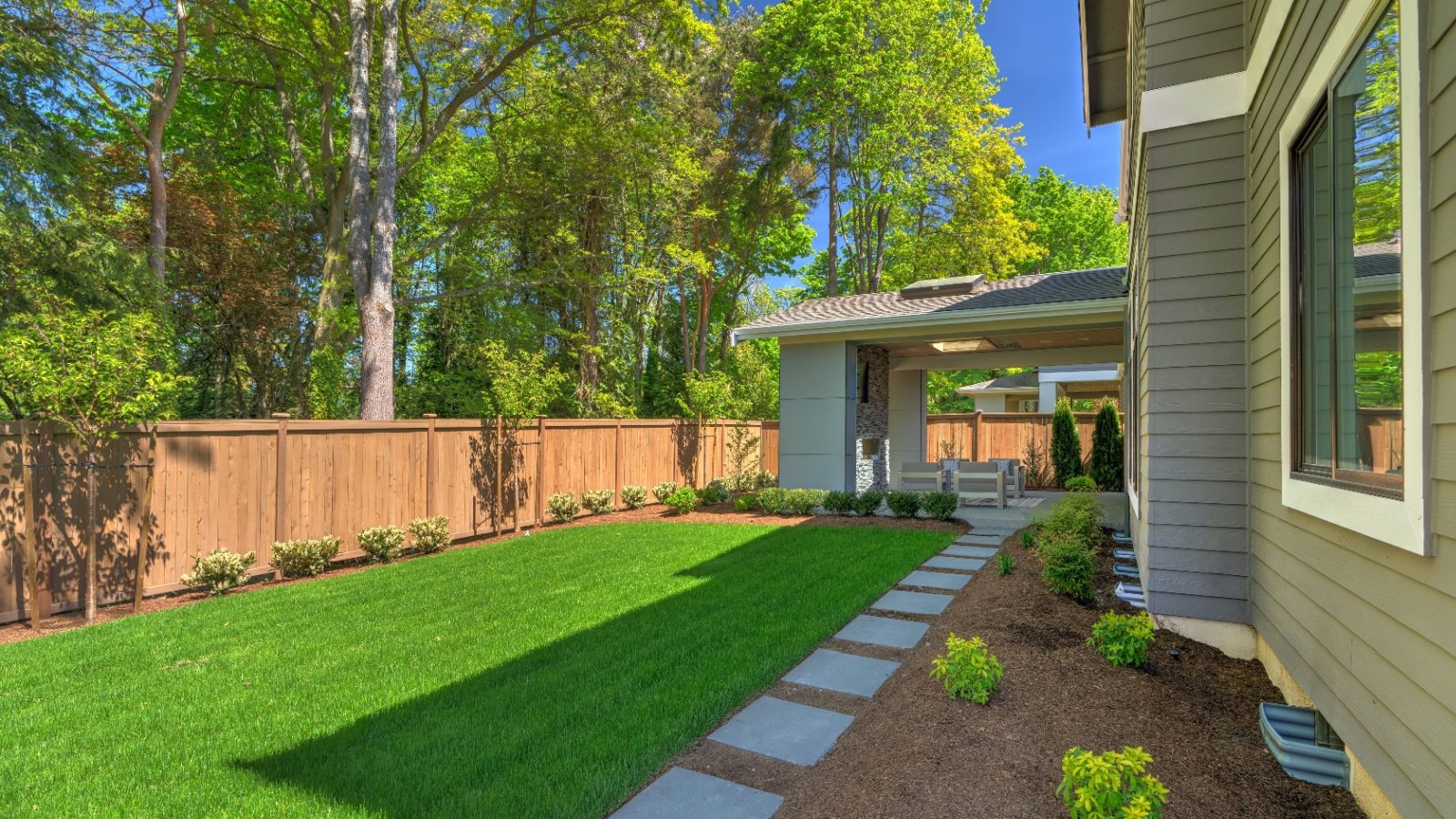 Backyard mulch landscape garden Artazum Shutterstock