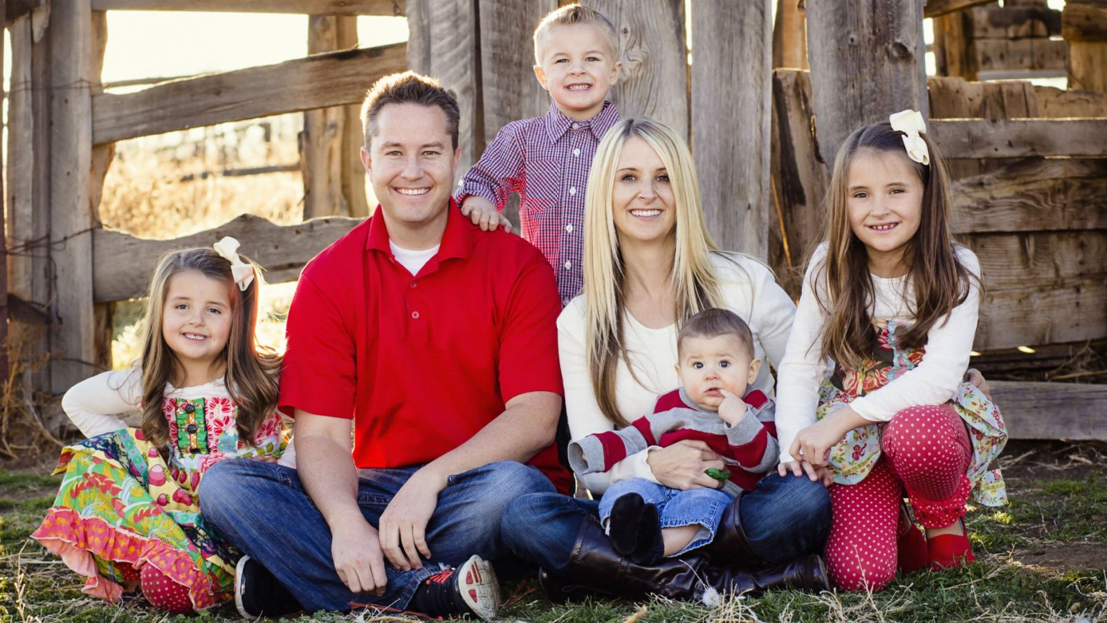 Beautiful Young Family outside barn farm brocreative shutterstock