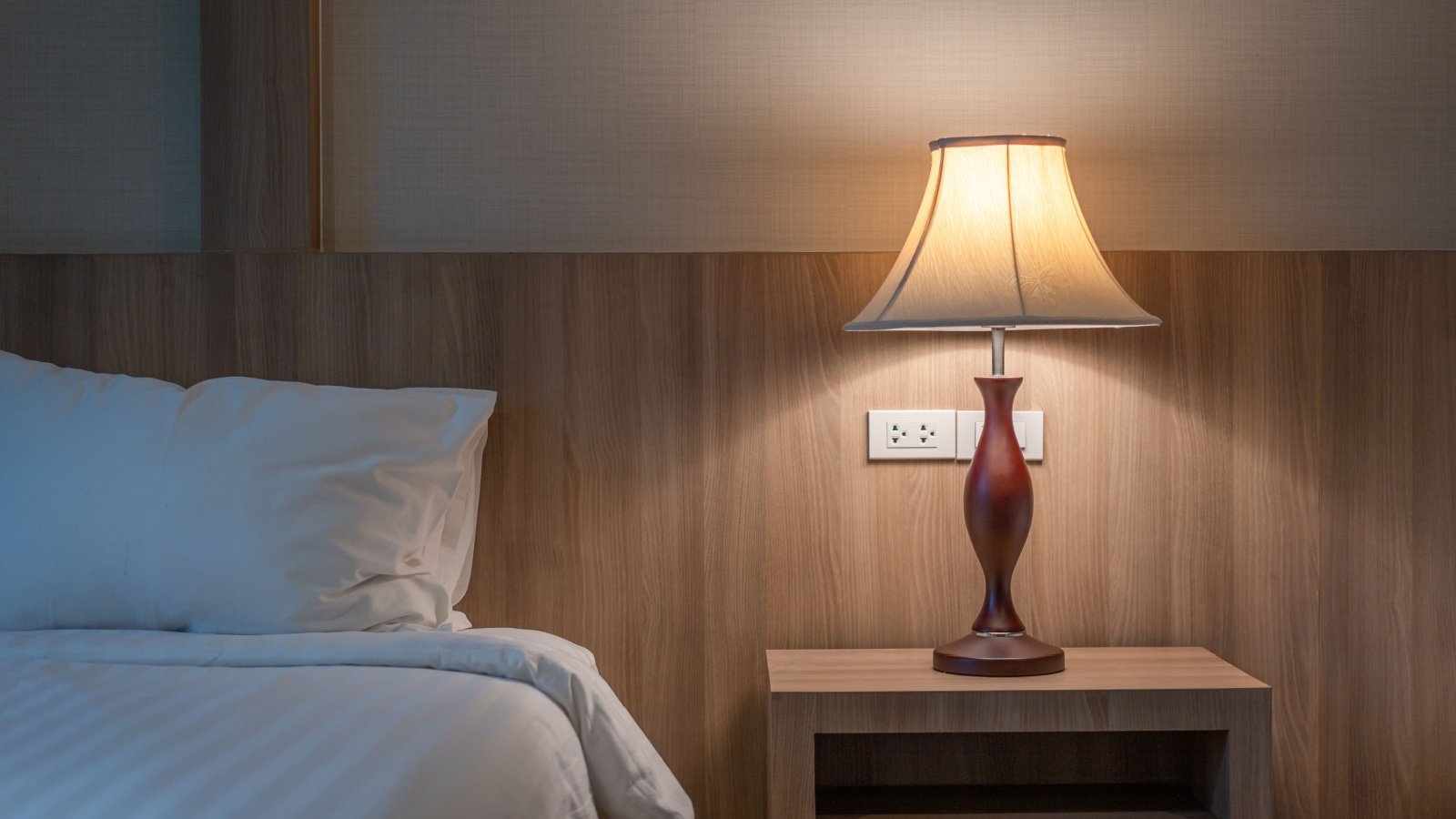 Bedside table lamp bedroom night sleep light minimal decor Supermop Shutterstock