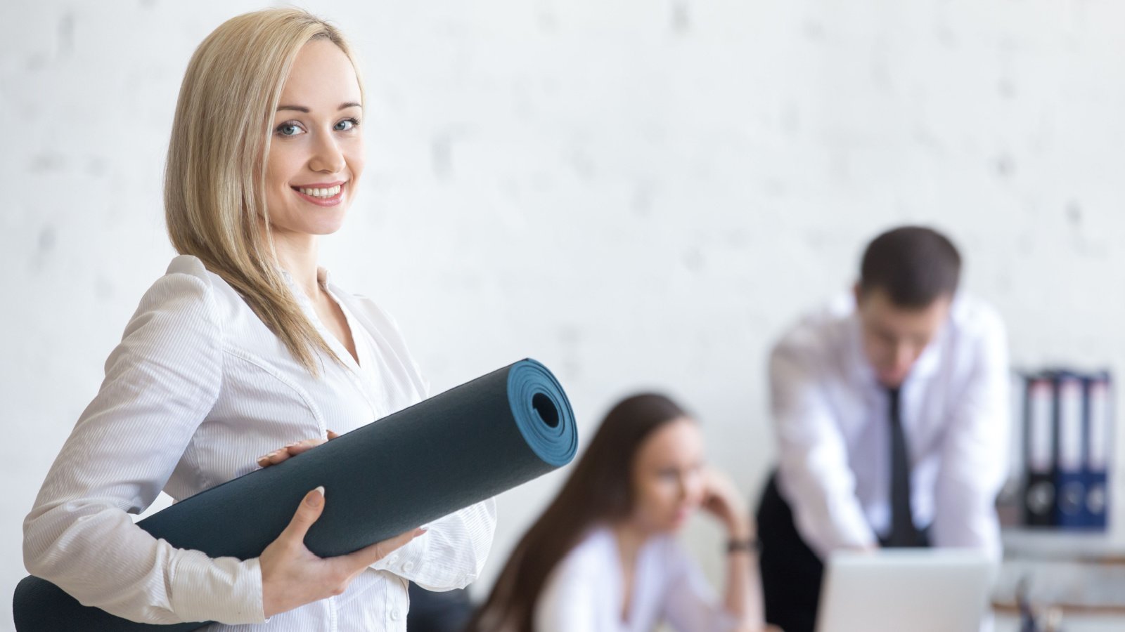 Business and healthy lifestyle corporate wellness yoga fizkes shutterstock