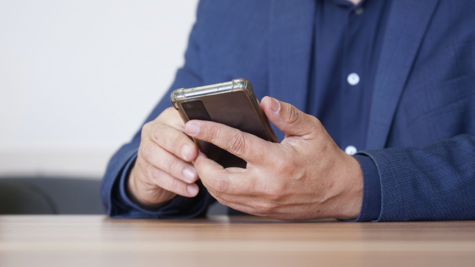 Business male uses cell phone to text call social media Manager lawyer businessman politician attorney slexp880 Shutterstock