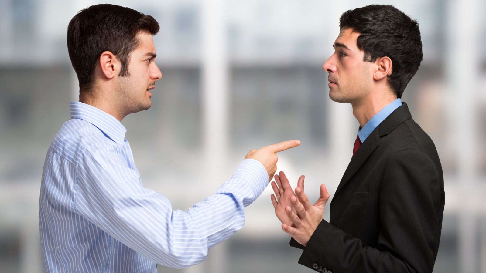 Business people having a discussion work fight men brothers argue jobs suits minerva studio shutterstock