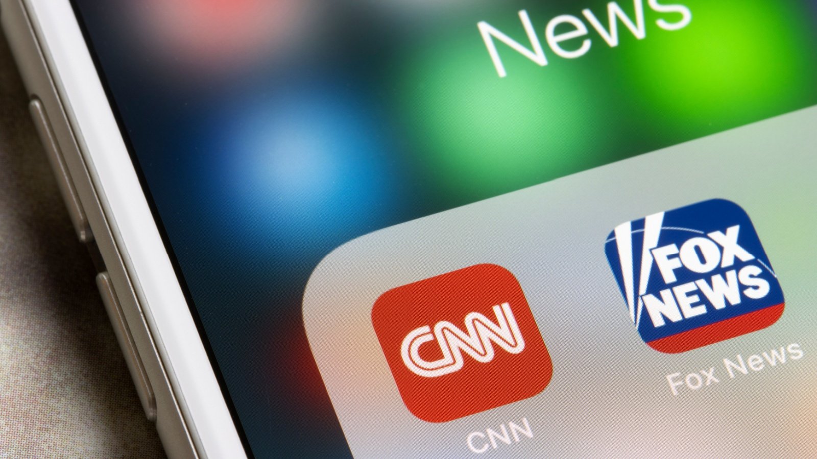 CNN and Fox News mobile app icons are seen on an iPhone network cable Tada Images Shutterstock