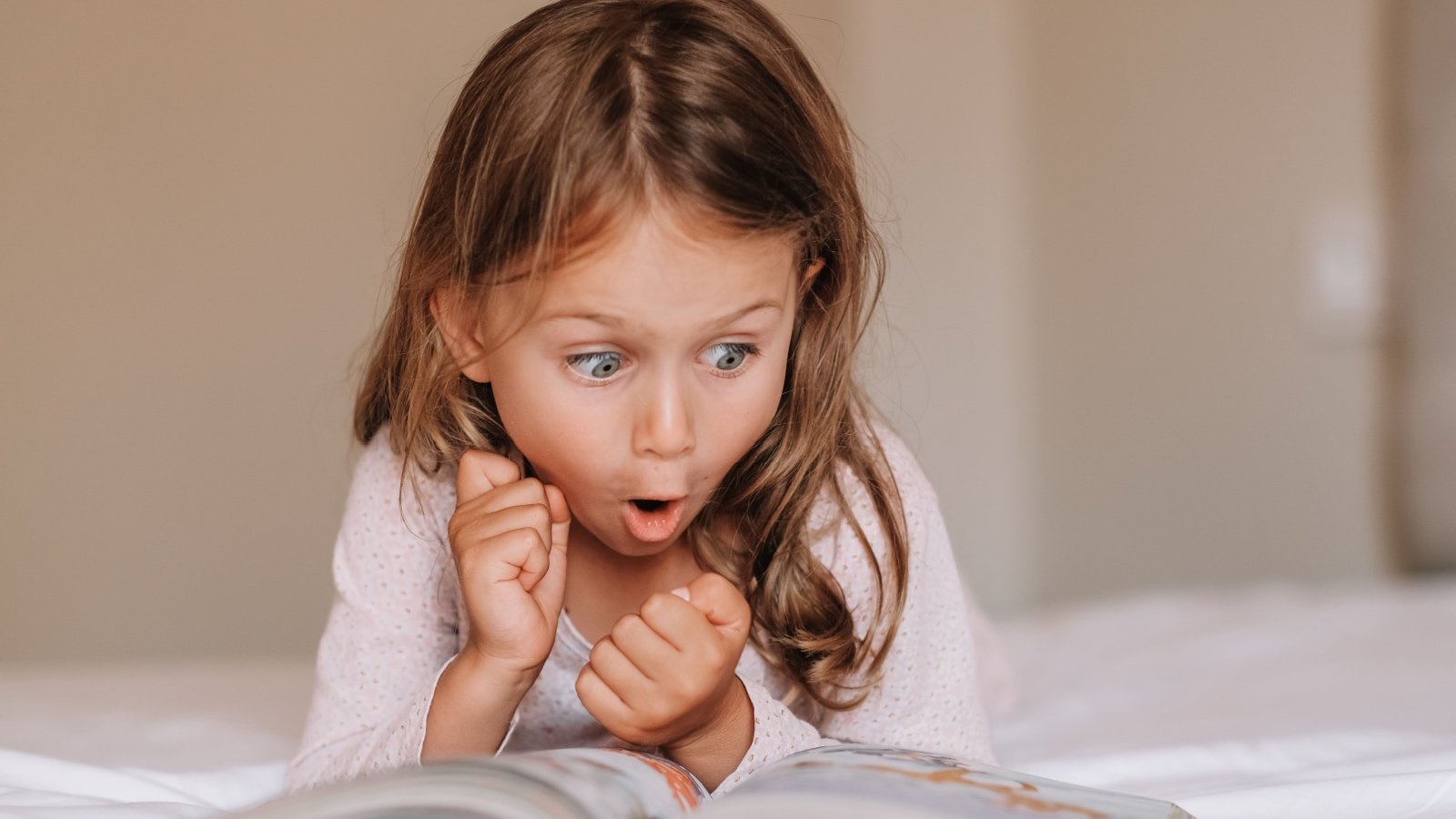 Child girl emotional reading book MariaTsygankova Shutterstock