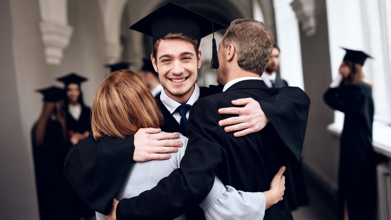 College high school graduate family VGstockstudio Shutterstock