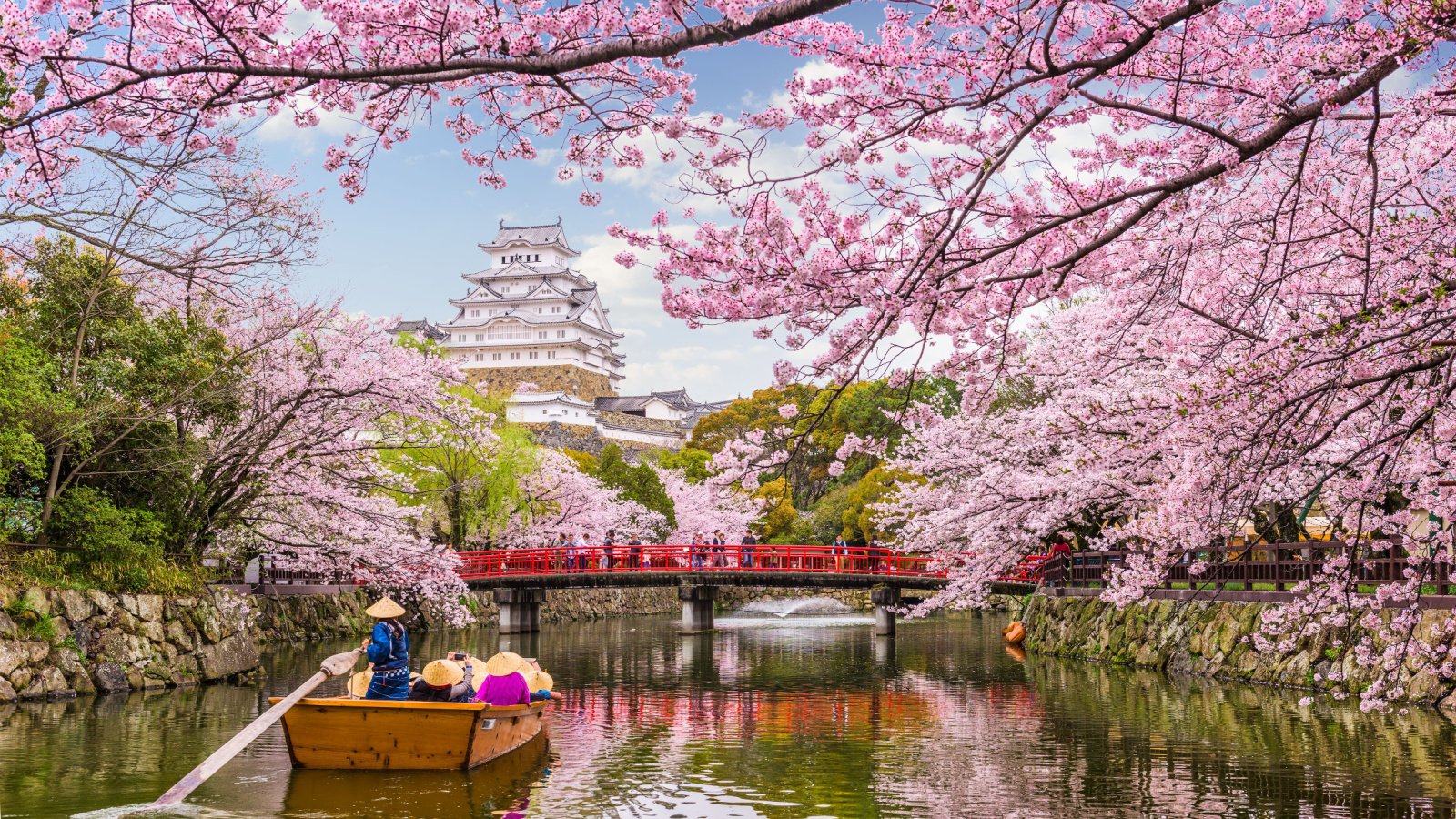 Country Vacation Travel Japan Cherry Blossom boat bridge Sean Pavone Shutterstock