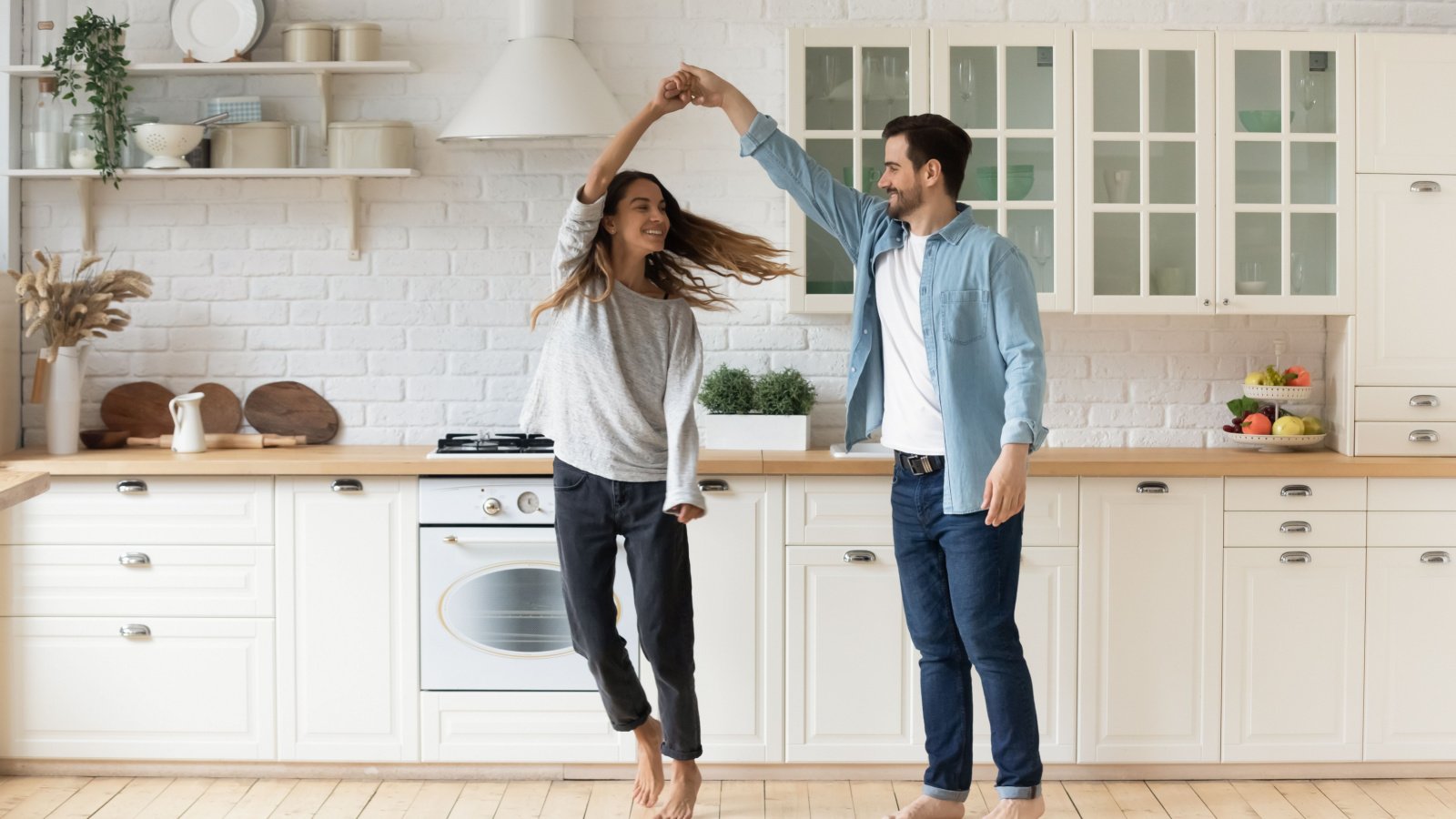 Couple Dancing in the Kitchen Home fizkes shutterstock