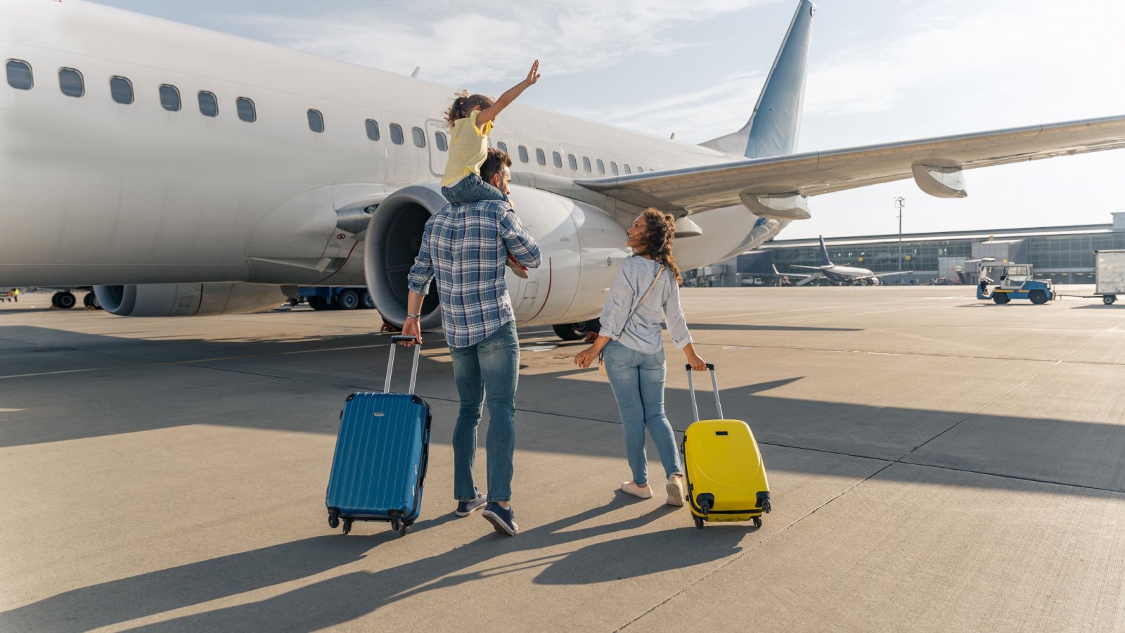 Couple Family Parenting Airplane plane travel runway Yaroslav Astakhov Shutterstock