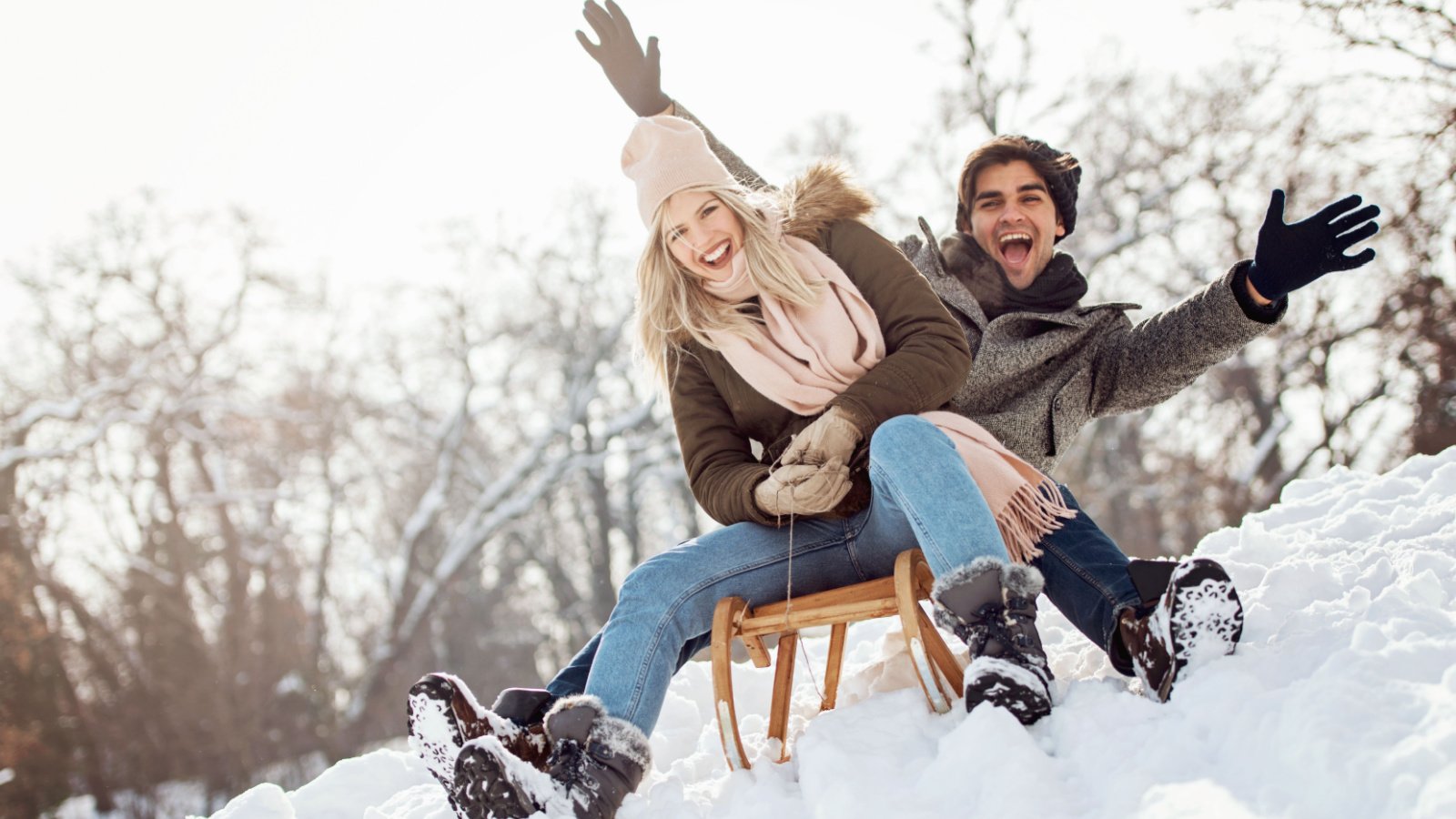 Couple Sledding Winter Cold Tijana Moraca Shutterstock