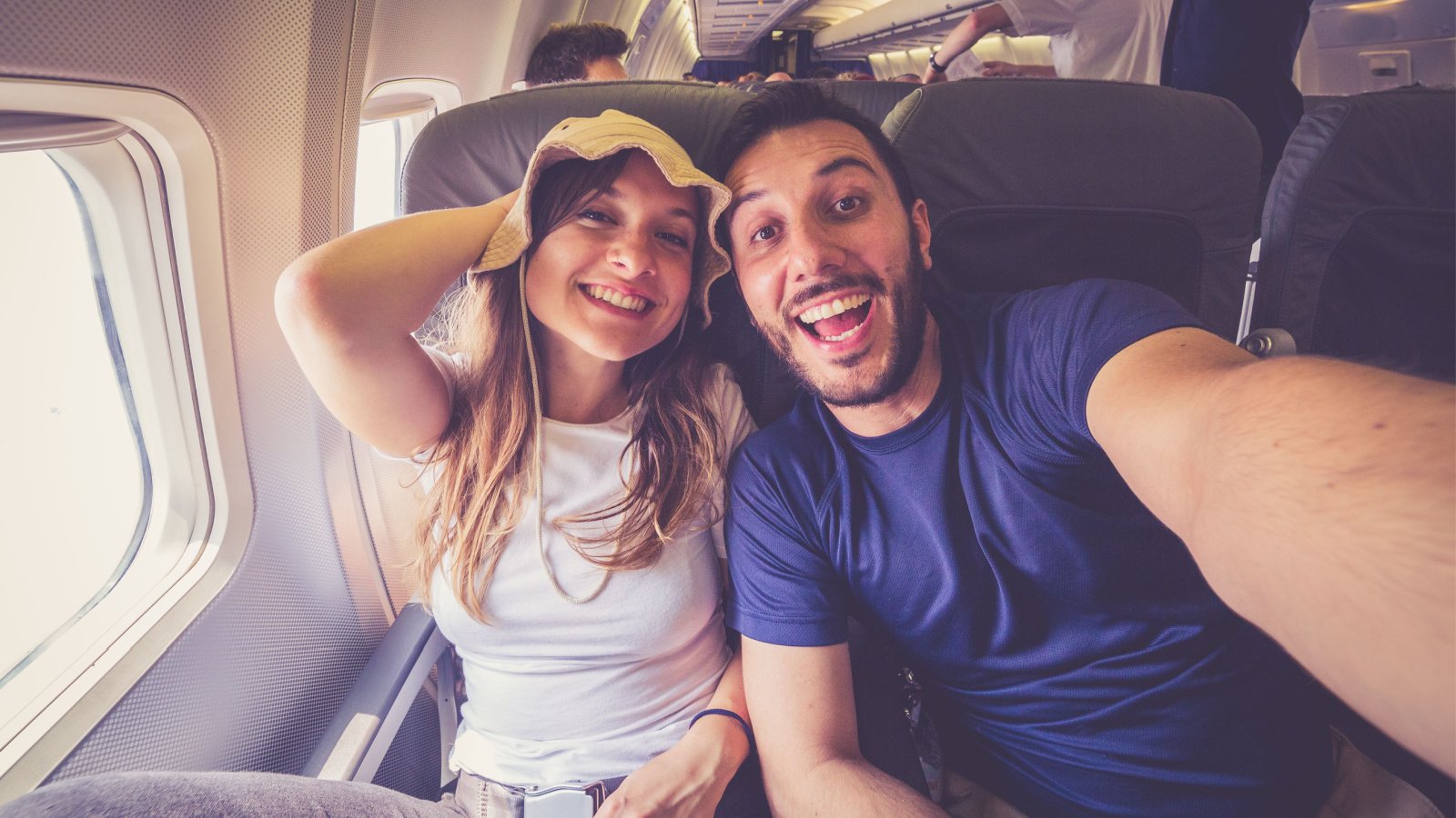 Couple Travel Young Honeymoon Airplane illpaxphotomatic Shutterstock