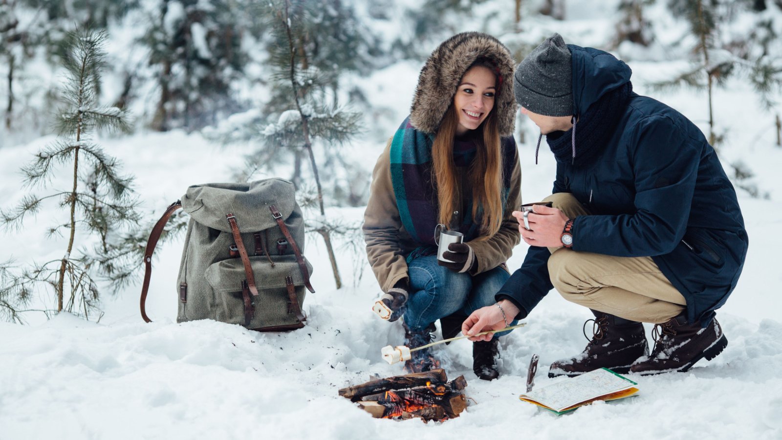 Couple travel camping winter smores Maksym Azovtsev Shutterstock