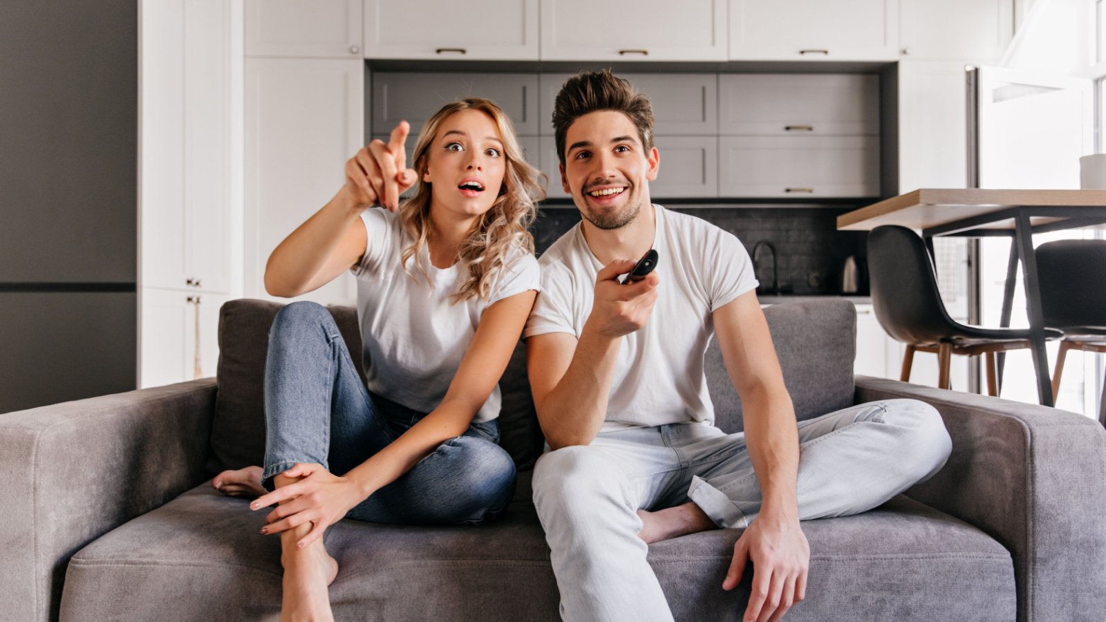 Couple watching television TV happy Look Studio Shutterstock