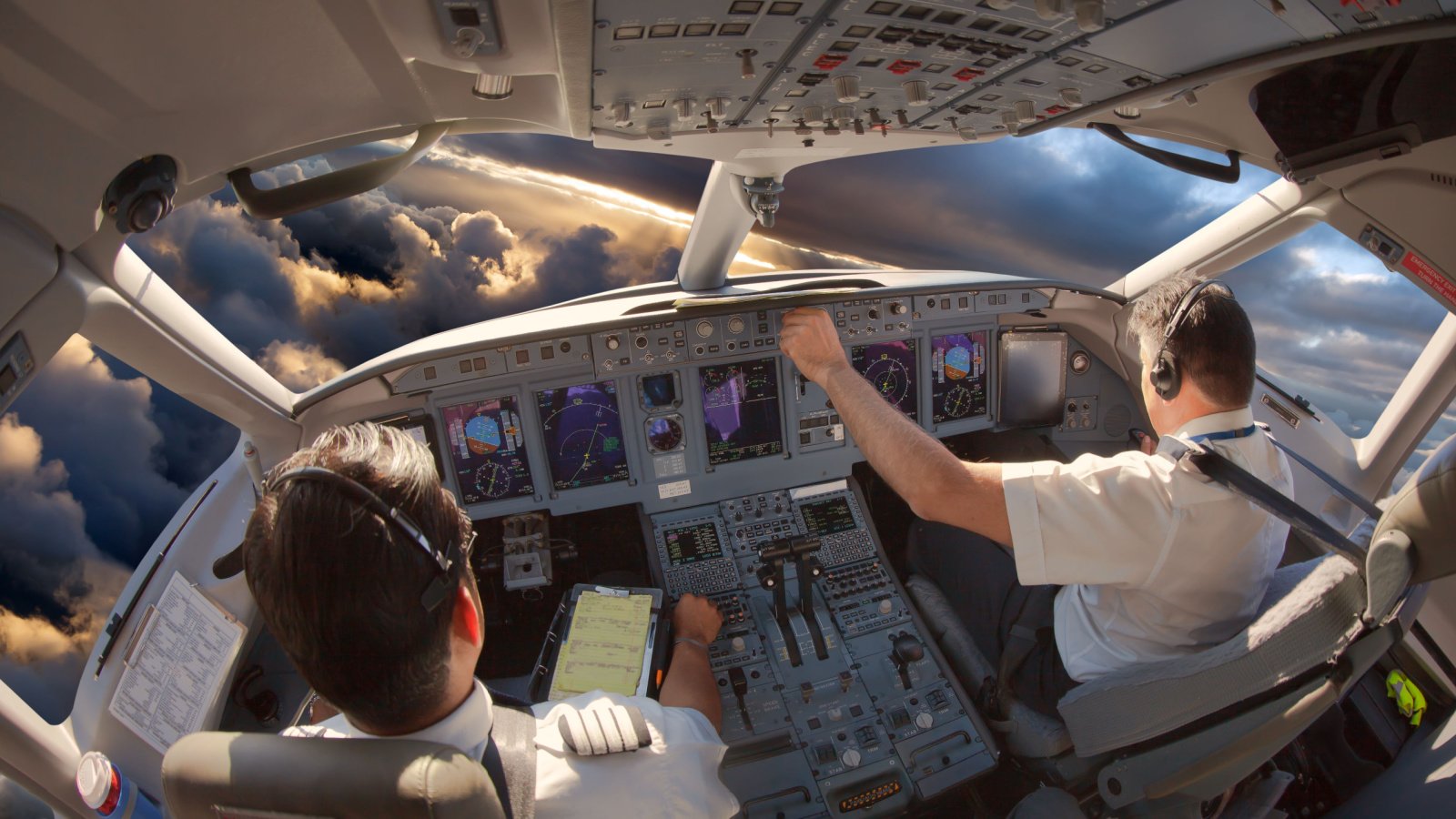 Crew Cockpit Pilot Flying Airplane travel Skycolors Shutterstock