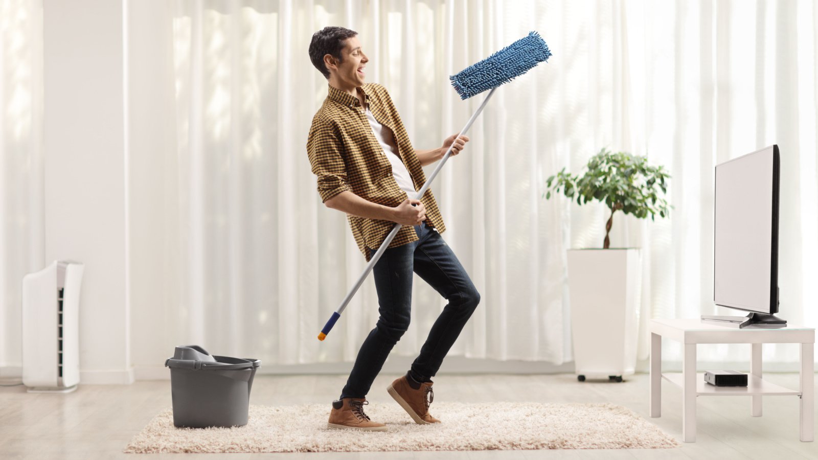 Dancing Housework Cleaning Mopping Living Room Ljupco Smokovski Shutterstock