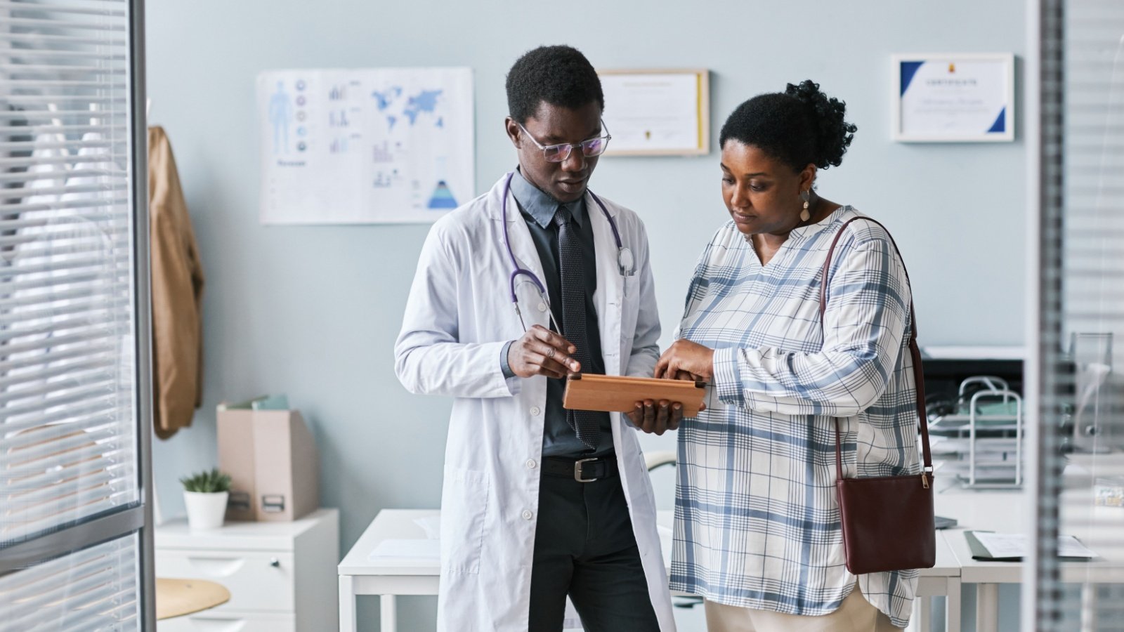 Doctor with patient overweight obesity medical SeventyFour Shutterstock