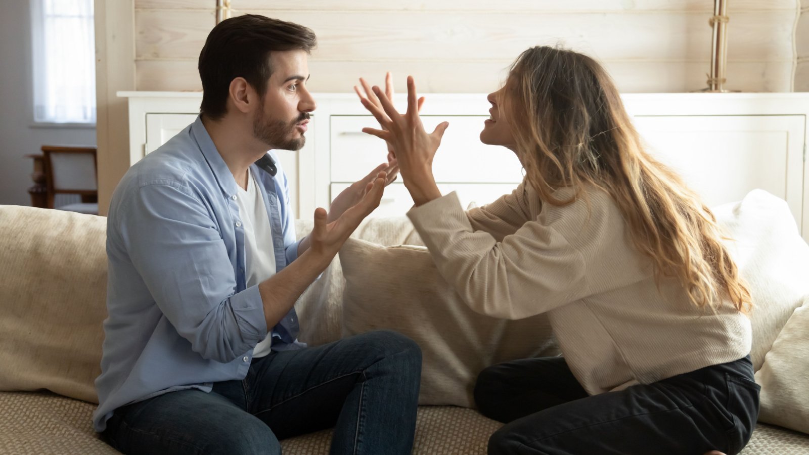 Emotional annoyed stressed couple fighting loud with each other fizkes shutterstock