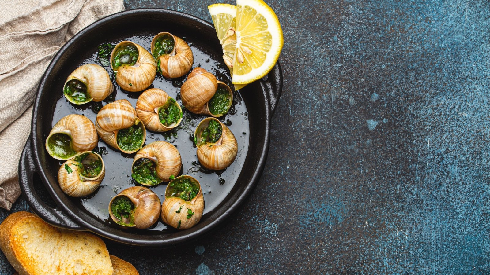 Escargots de Bourgogne Snails lemon toasted baguette Elena Eryomenko Shutterstock