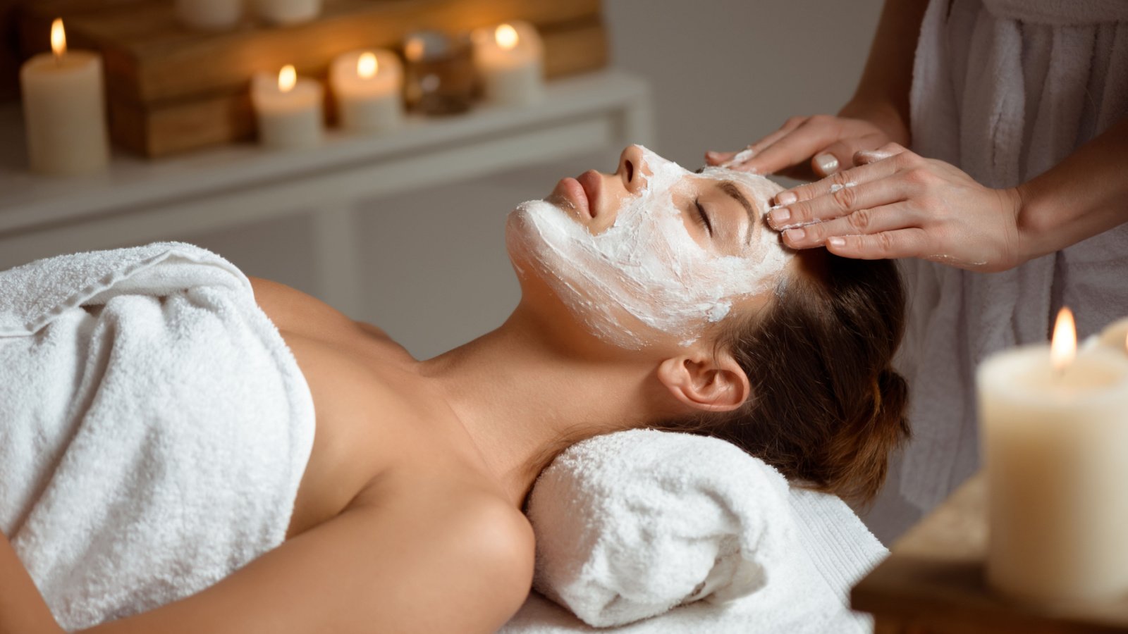 Facial face mask spa relaxing candles Cookie Studio Shutterstock