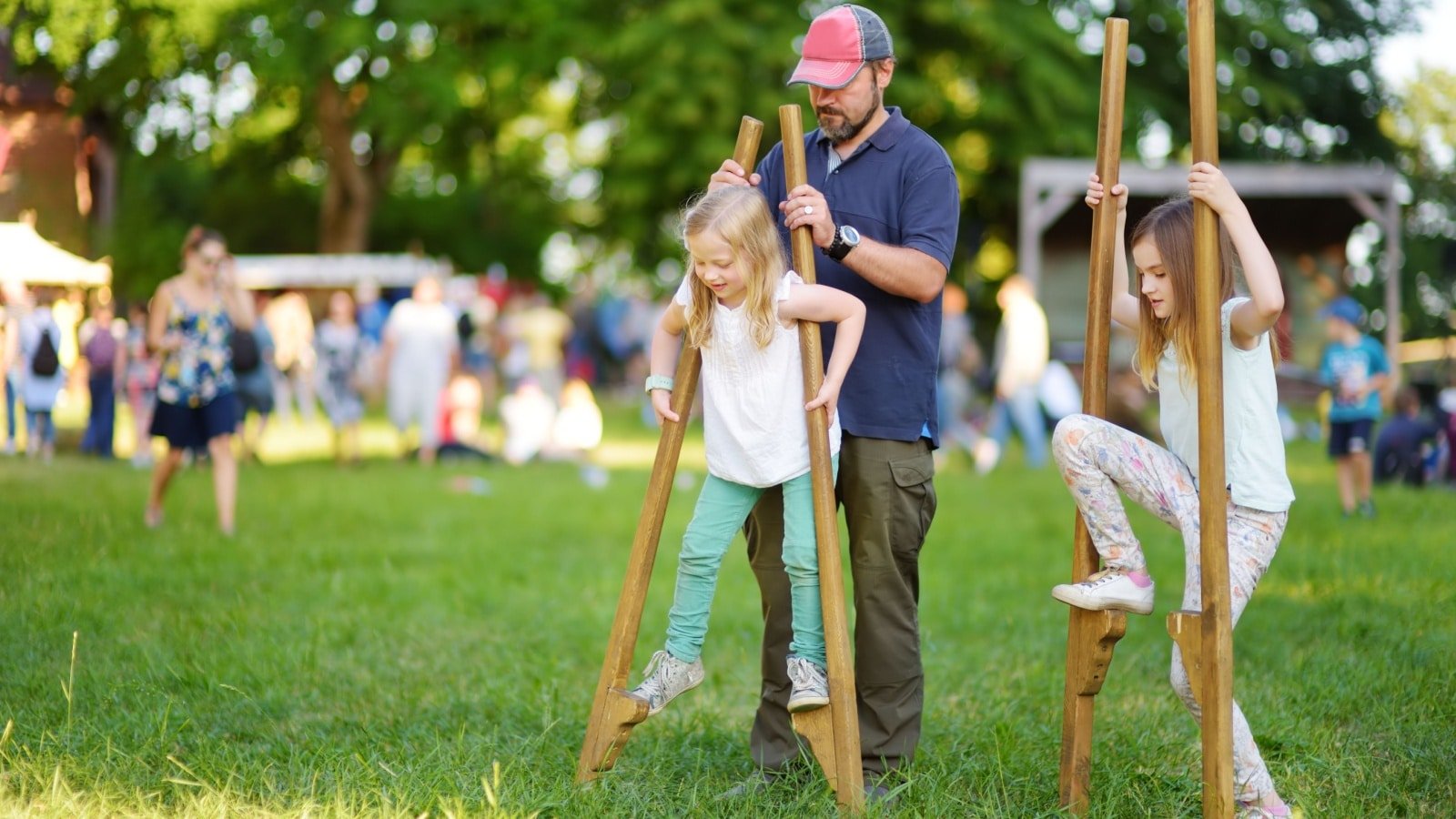 Father Children Stilt Walking Festival MNStudio Shutterstock