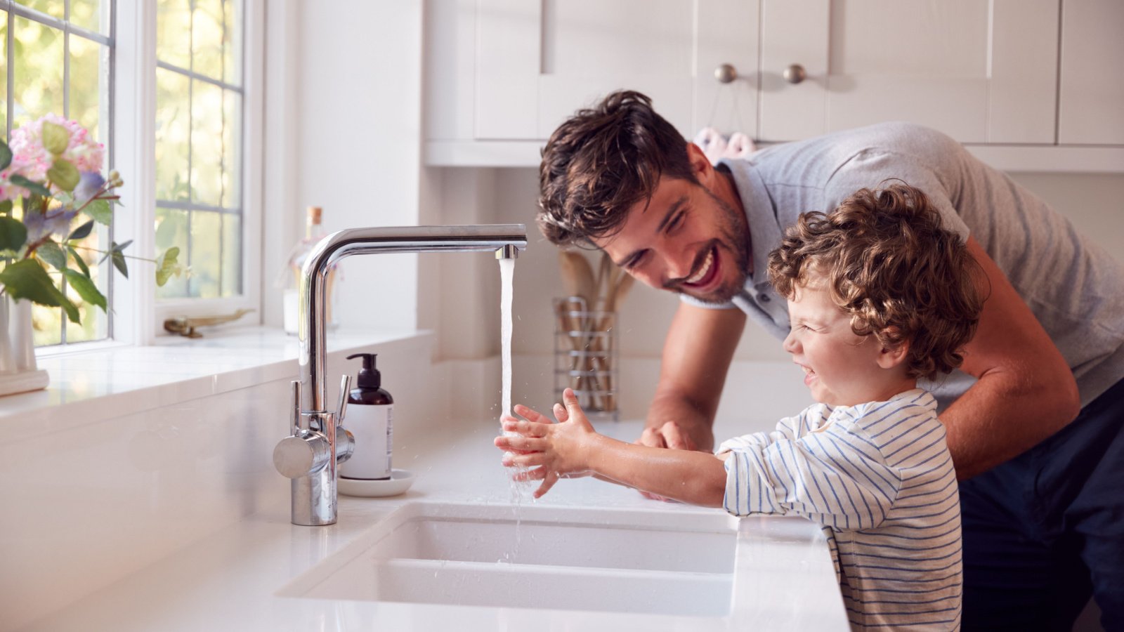 Father Helping Son To Wash Hands With Soap At Home To Stop Spread Of Infection In Health Monkey Business Images Shutterstock