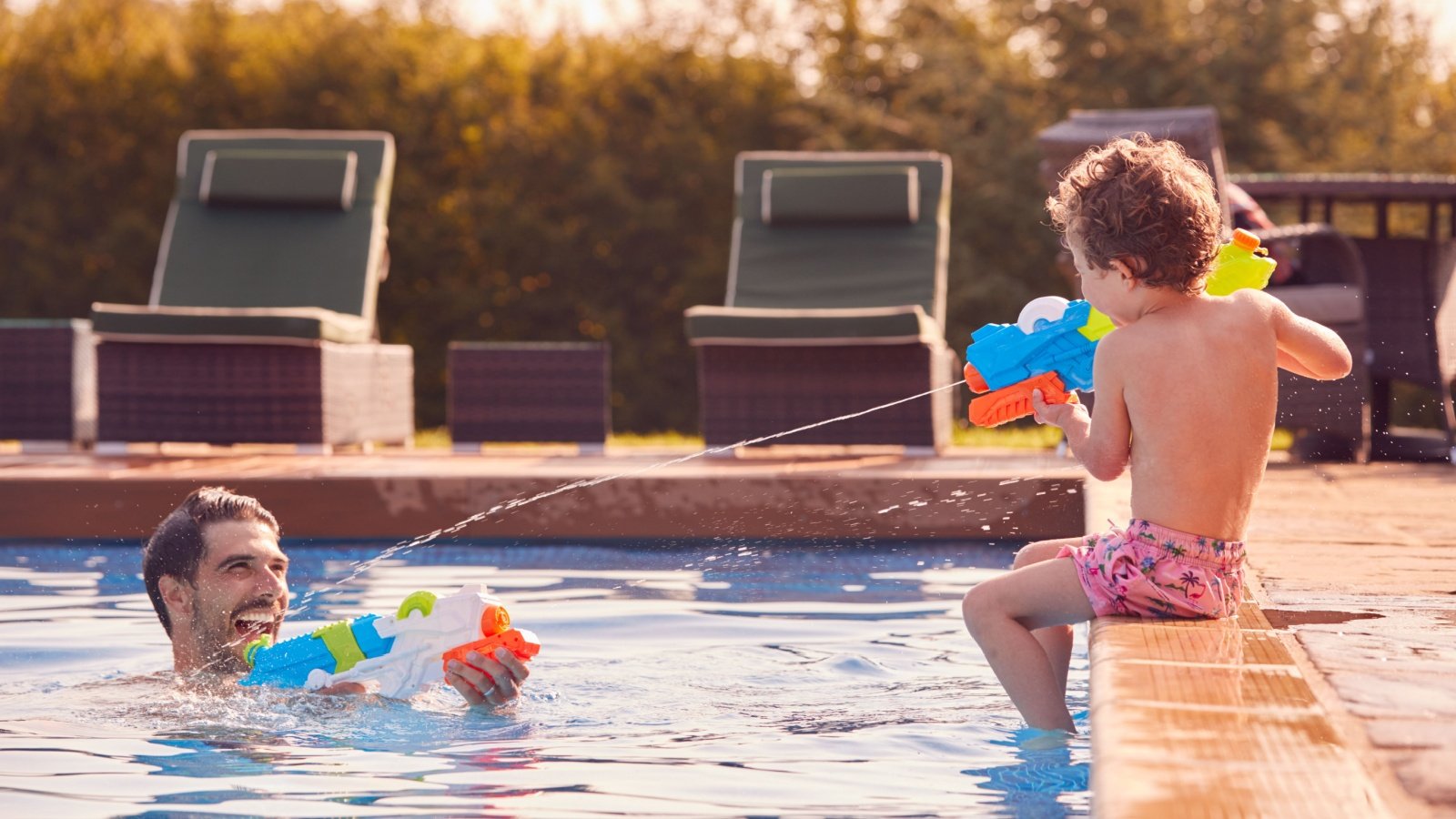 Father Son Boy Kid Child Swim Pool Water Gun Monkey Business Images Shutterstock