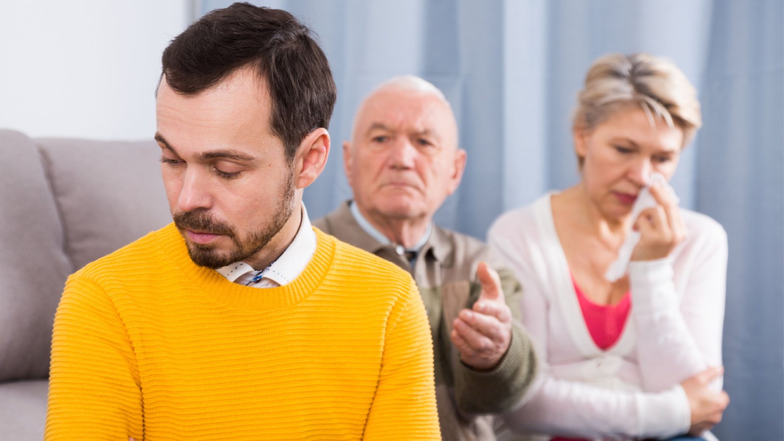 Father and mother having disagreement with adult son at home parents fight bear fotos shutterstock