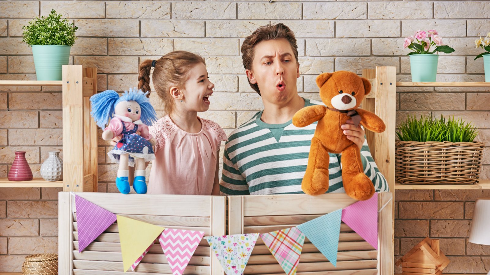 Father daughter puppet show kid girl stuffed toy Yuganov Konstantin Shutterstock