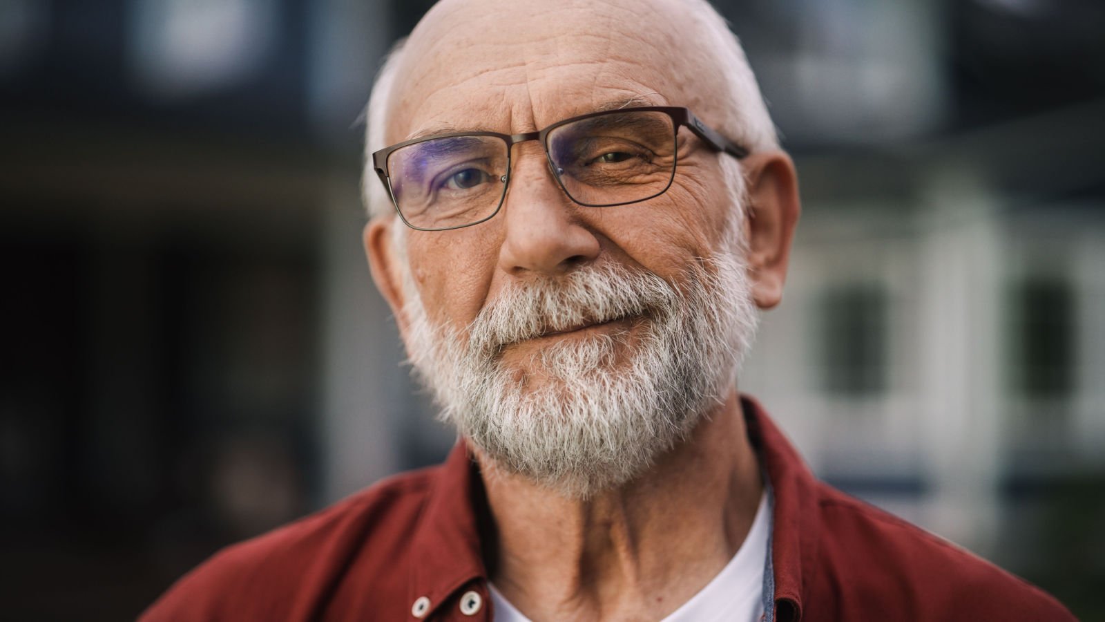 Father with Gray Hair Wearing Glasses Standing Outdoors in Front yard lawn house neighborhood gorodenkoff shutterstock