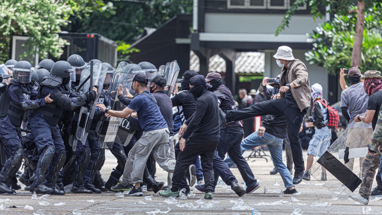 Fight between citizens and police riot uprising protest violent crowd violence boyphare Shutterstock