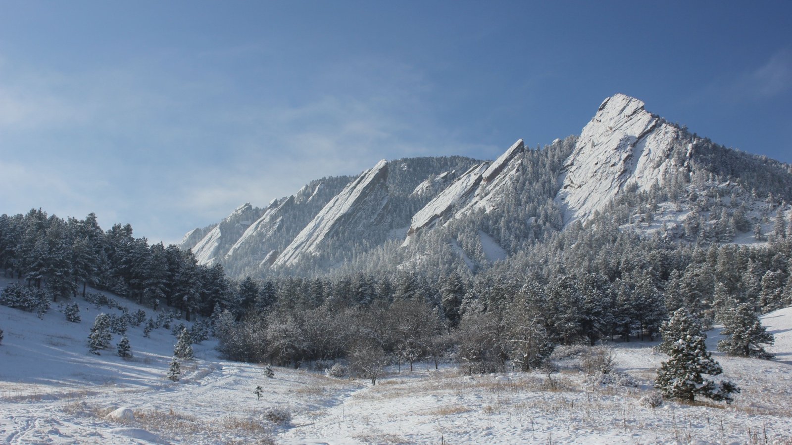 Flatirons Mountains Boulder Colorado with snow Taylor Shain Shutterstock