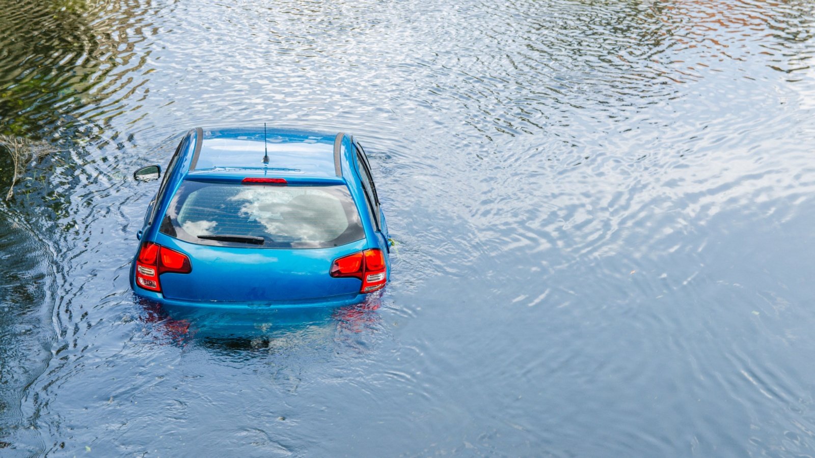 Flooded car street flooding storm weather rain Aliaksandr Antanovich Shutterstock