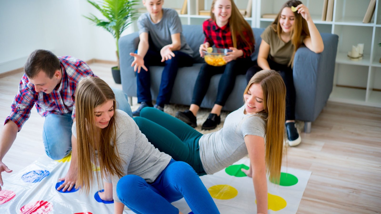 Friends Playing Twister Game Elena Nichizhenova Shutterstock