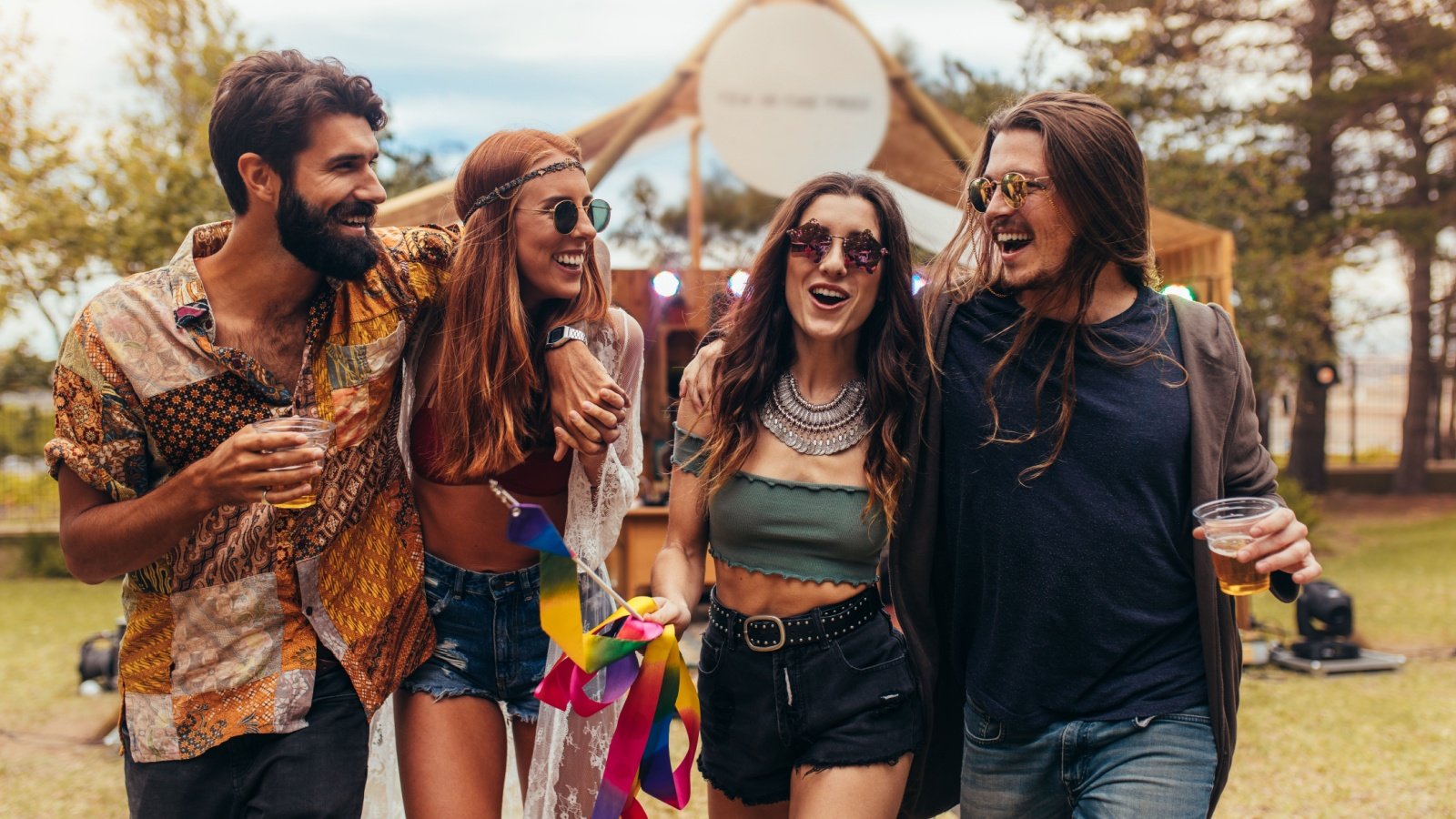 Friends at music festival in a park hippie young outdoor Jacob Lund Shutterstock