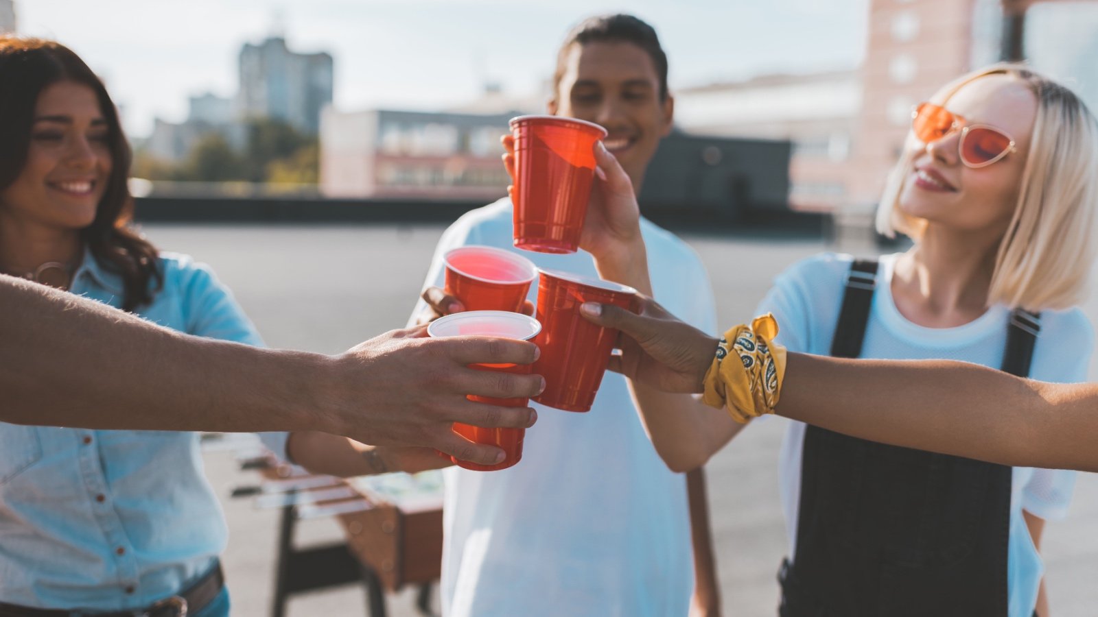 Friends celebrating with red solo cup drinks LightField Studios Shutterstock