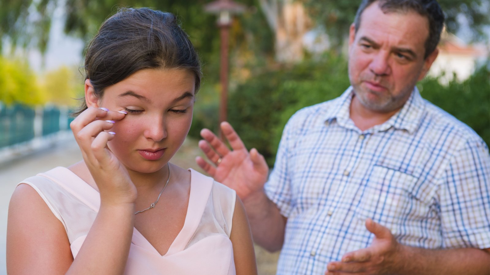 Girl teenager daughter and her father quarrel fight outdoors oleg golovnev shutterstock