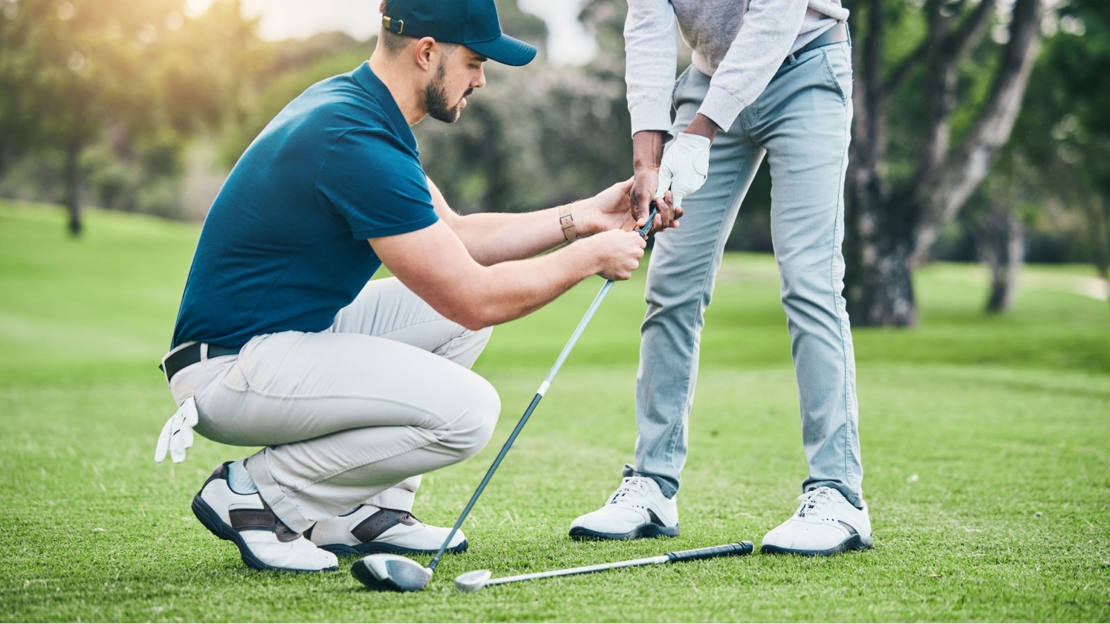 Golf Lesson Teaching Coach PeopleImages.com Yuri A Shutterstock