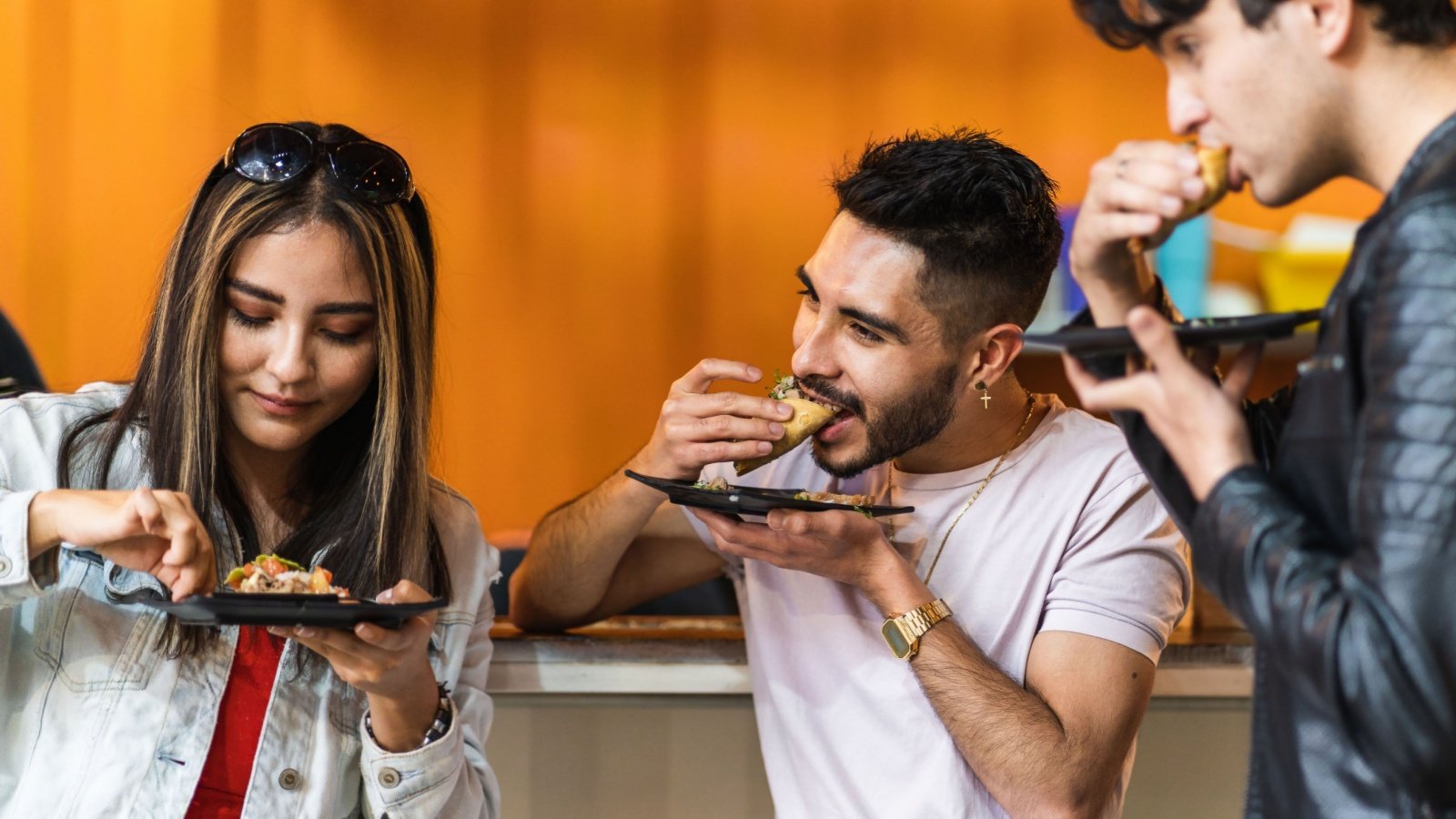 Group of Friends Eating Tacos Eduardo Rgz Shutterstock