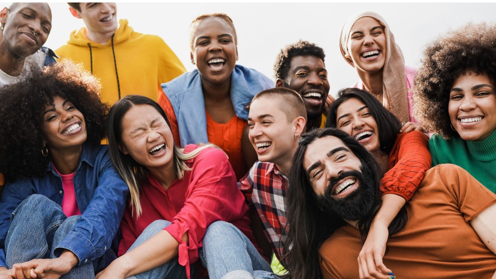 Group of multiracial people diverse young friends smile happy fun adult Sabrina Bracher Shutterstock