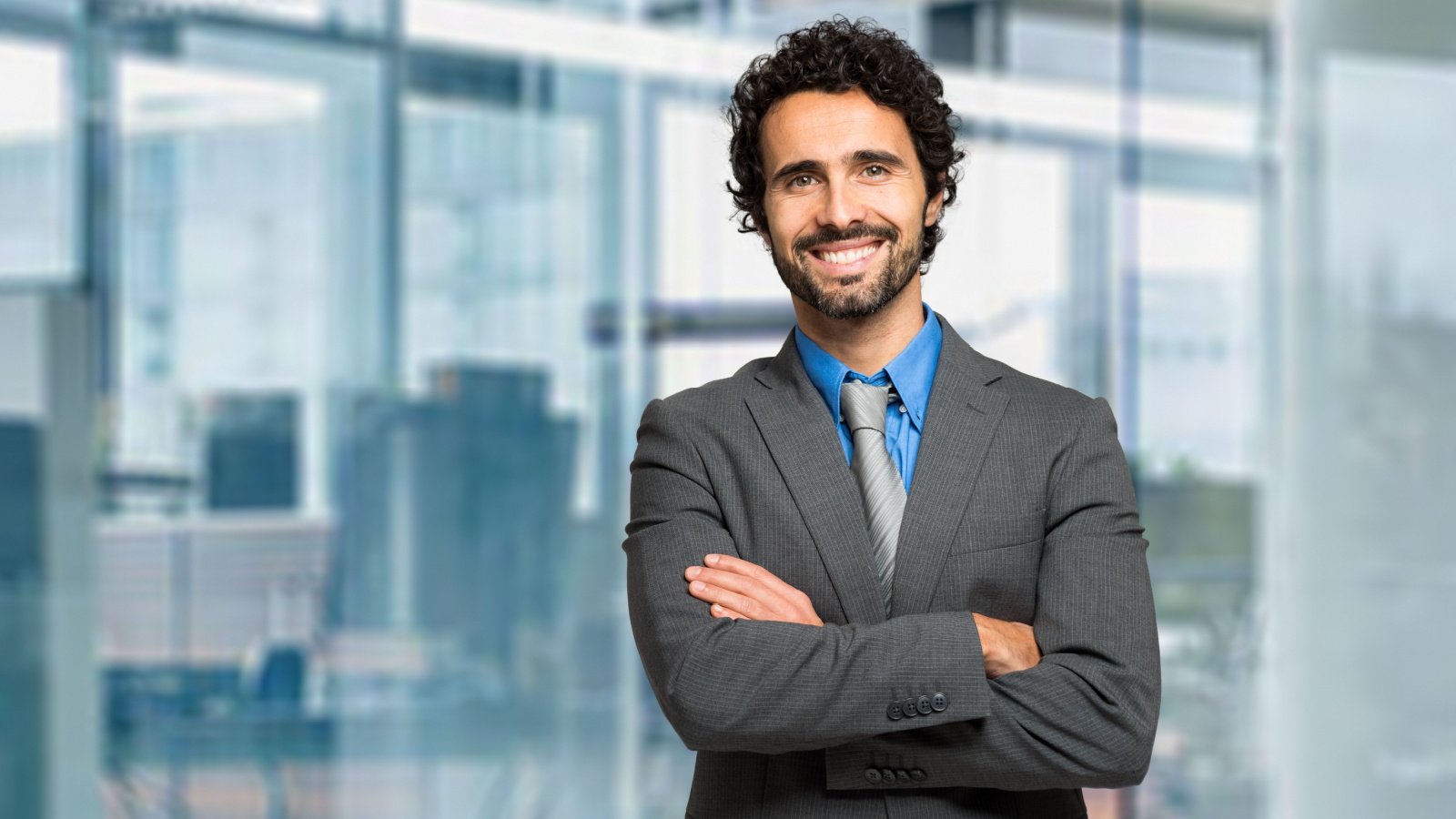 Handsome finance male business smiling looking up suit work minerva studio shutterstock