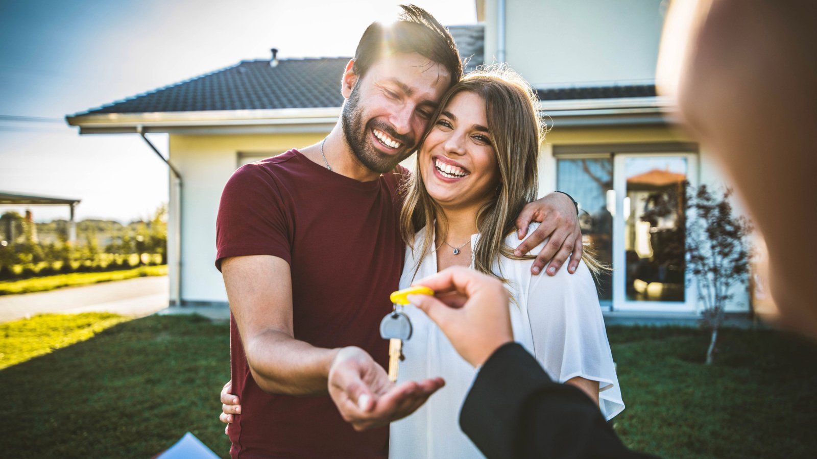 Happy First Time Home Buyers Couple Renting Keys DavideAngelini Shutterstock