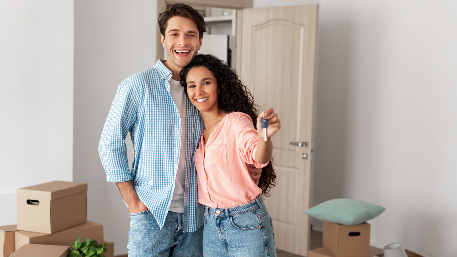 Happy Young Couple Home Buyer First Time Morgage Renting Moving in together Prostock studio Shutterstock