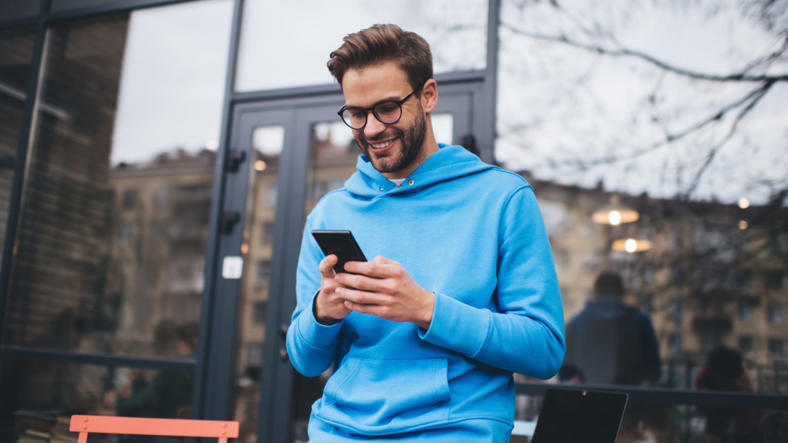 Happy hipster social media phone coffee GaudiLab Shutterstock