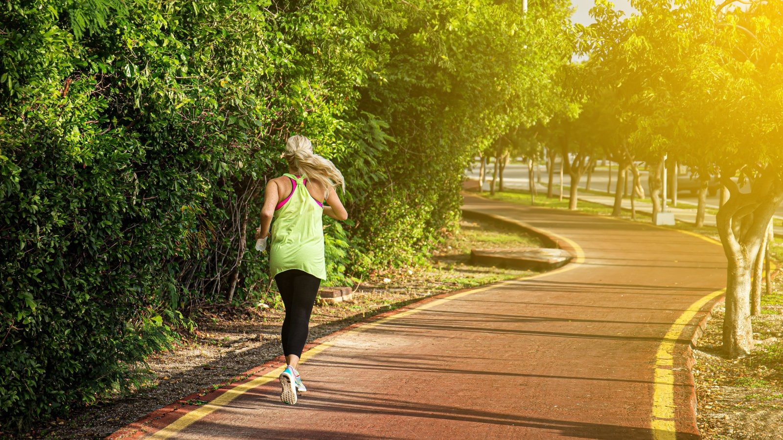 Healthy fitness woman training and jogging and running outside photopixel Shutterstock