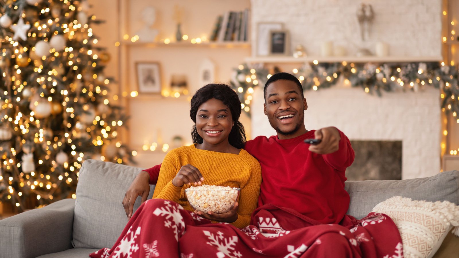 Holiday Movie POC couple woman male popcorn christmas Prostock studio Shutterstock